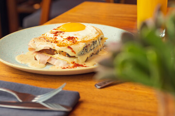 Two fried free range eggs on toast for breakfast with yellow yolks. Gourmet breakfast concept in restaurant Eggs in creamy sauce