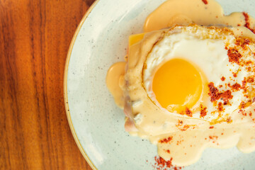 Two fried free range eggs on toast for breakfast with yellow yolks. Gourmet breakfast concept in restaurant Eggs in creamy sauce