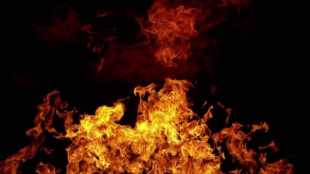 Super slow motion of fire isolated on black background. Filmed on high speed cinema camera, 1000 fps. Speed ramp effect.