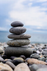 stack of zen stones on pebble beach