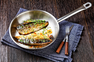 fried mackerel fillets with spices and herbs - obrazy, fototapety, plakaty