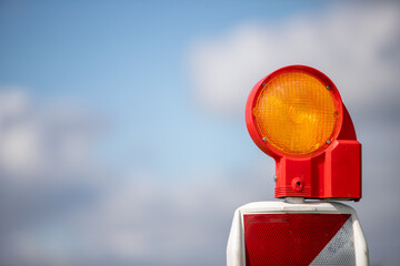 construction site lamp, bokeh blue cloud sky in the background