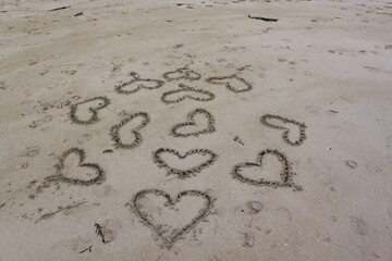 hearts drawn on the beach sand - Haukland, Lofoten