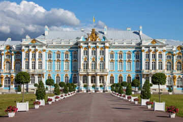 the magnificent blue and white Catherine Palace with beautiful plant beds and trees on a sunny .summer day in Tsarskoye Selo in Leningrad region