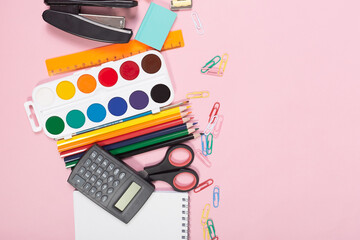 School stationery on pink background. Close-up