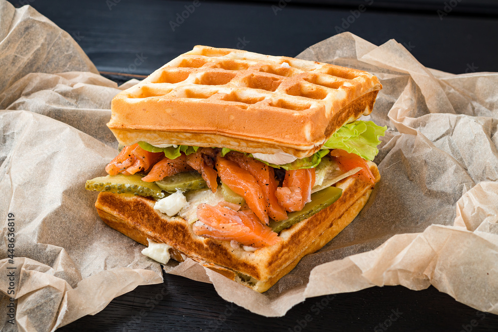 Canvas Prints belgian waffle with salmon on wood table. keto breakfast variation.