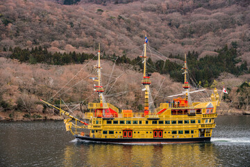 Yellow pirate ship in Japan. Tourists sail across Lake Ashi in Fuji Hakone Izu National Park 