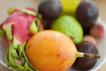 Group of fresh tropical fruits, passion fruit, carambola, dragon fruit or pitaya, mangosteen, lichi, granadilla. Exotic fruits, healthy eating concept