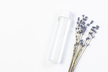 Minimalism style composition with natural skin care product lotion or tonic with aromatic lavender...