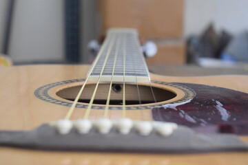 Acoustic guitar close-up from the bridge