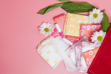 Menstrual tampons and pads in cosmetic bag. Menstruation cycle. Hygiene and protection