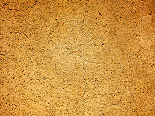 the old yellow texture of the walls .The structure of decorative plaster in close-up 