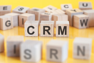 word crm written on wood blocks, concept