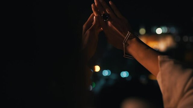 a girl looks at ring with a diamond on her finger