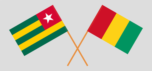 Crossed flags of Togo and Guinea. Official colors. Correct proportion