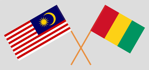 Crossed flags of Malaysia and Guinea. Official colors. Correct proportion