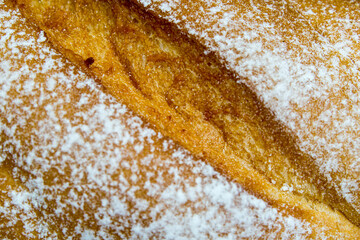 Baguette. Fresh golden baguette on an old wooden table. French baguette crust close-up. Traditional French bread. Top view. - 448643696