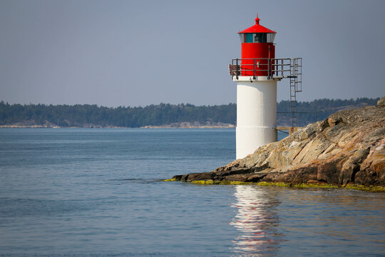 A lighthouse painted in red and white.