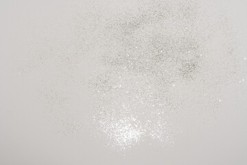 silver sprinkles, makeup, fashion details on a white background