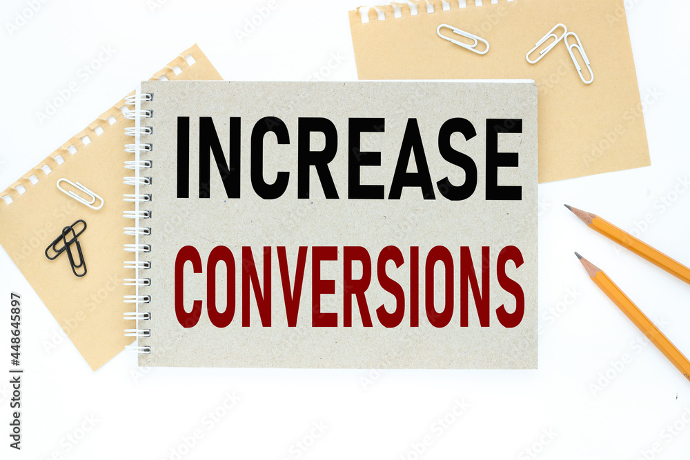 Poster increase conversions. text on notepad on white background