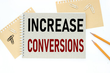 Increase Conversions. text on notepad on white background