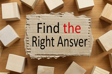 FIND THE RIGHT ANSWER. text on torn cardboard on wood cubes background