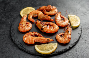 grilled giant prawns on a stone background