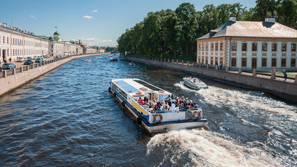 view of tourist ships on the Fontanka canal in St. Petersburg, Russia