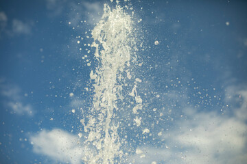 The fountain jet against the background of the sky.