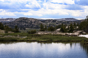 Fototapeta na wymiar Beartooth Lake in Rocky Mountains along Beartooth Highway, an All-American Scenic Byway, in June