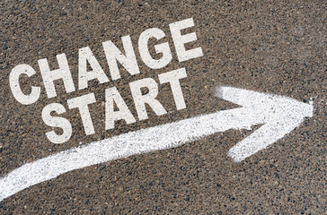 On the asphalt road markings an arrow with the inscription - CHANGE START