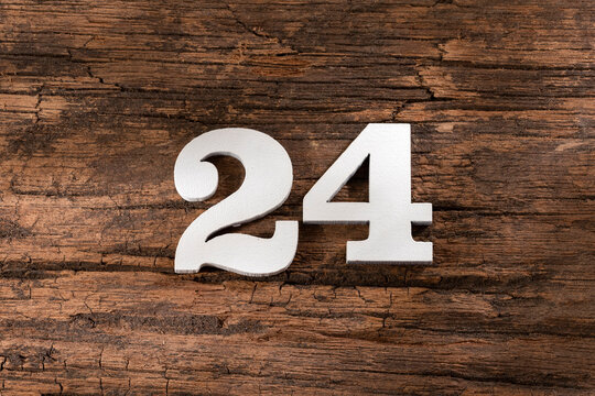 twenty four 24 - White wooden number on rustic background
