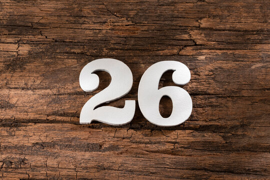 twenty six 26 - White wooden number on rustic background