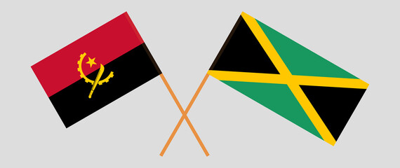 Crossed flags of Angola and Jamaica. Official colors. Correct proportion