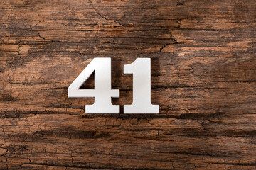 Number forty one 41 - White Piece on Rustic Wood Background