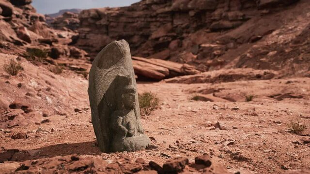 Ancient Statue on the Rocks Desert