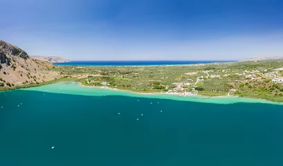 Foto op Plexiglas Panoramic aerial view of a huge freshwater lake surrounded by tall mountains (Lake Kournas, Crete,Greece) © whitcomberd