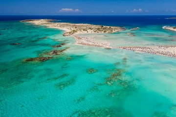 Photo sur Plexiglas  Plage d'Elafonissi, Crète, Grèce Aerial view of shallow sandy lagoons and a beach surrounded by deeper dark blue sea (Elafonissi Beach)