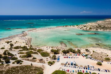 Photo sur Plexiglas  Plage d'Elafonissi, Crète, Grèce Aerial view of a beautiful but busy sandy beach and shallow lagoons surrounded by clear, blue ocean (Elafonissi, Crete)