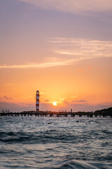 lighthouse sunrise at the beach
