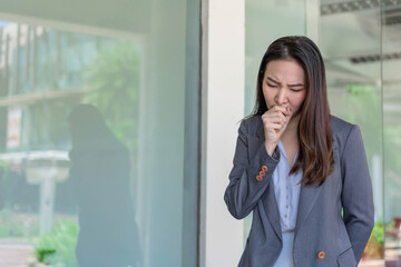 Working woman concept a working woman coughing after contacting with many people while working without any protection