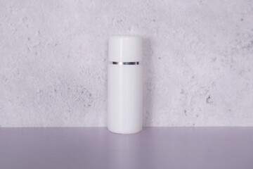 Mockup cosmetic bottle with cream or lotion on desk, mock up package for advertising, skincare or cosmetology, skin care and treatment with product.