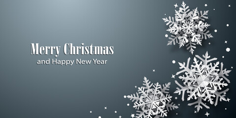 Christmas background of paper snowflakes with soft shadows, white on gray background