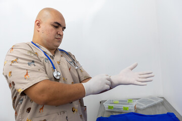 Veterinarian doctor putting on white gloves