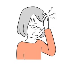 頭痛がする高齢者の女性