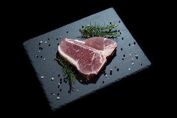 Fresh T-Bone Cut on Dark Granite Counter