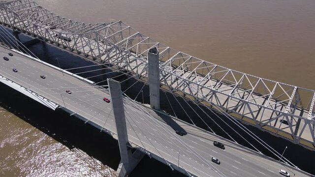 Drone Aerial View of Traffic on John F Kennedy and Abraham Lincoln Bridges Above Ohio River in Louisville, Kentucky USA 60fps