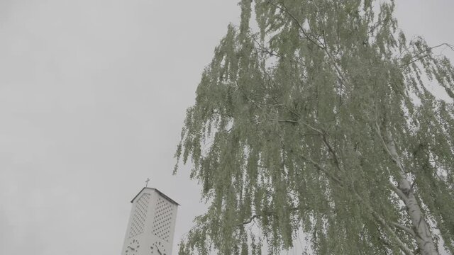 Exterior view of the Bruder Klaus church in Gundelfingen, Germany on a cloudy day