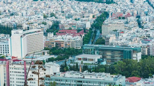 Day to night Time lapse of Athens Hilton hotel and national gallery at Basilisis Sofias str