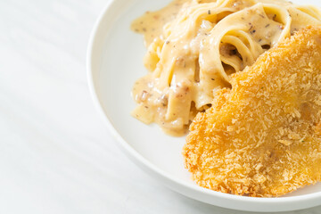 fettuccine pasta white cream sauce with fried fish